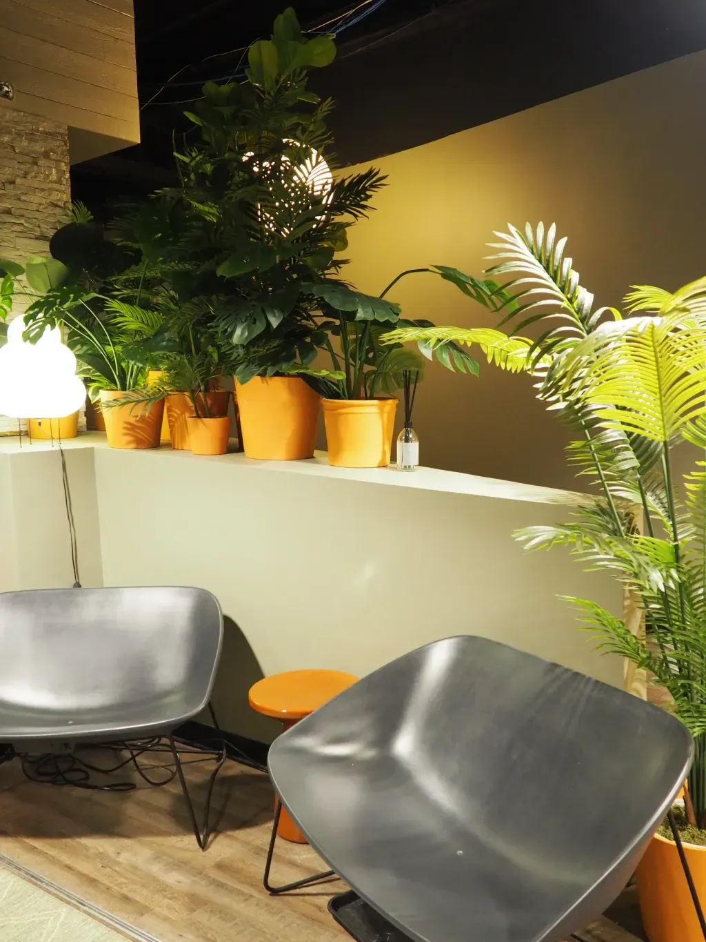 Lounge benches and warm-light decor in the Sauna Culture studio between rounds